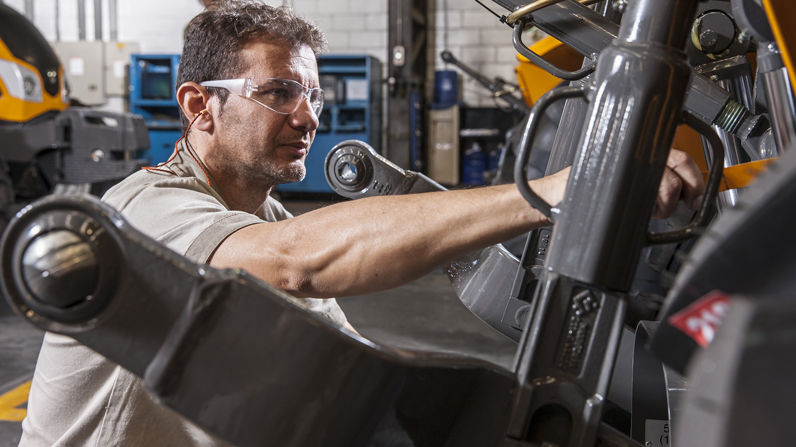 valtra tractor and man doing maintanance